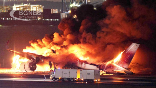 A Japan Airlines plane was on fire on the runway at Tokyo's Haneda Airport after a possible collision with a coast guard plane, Japanese television reported