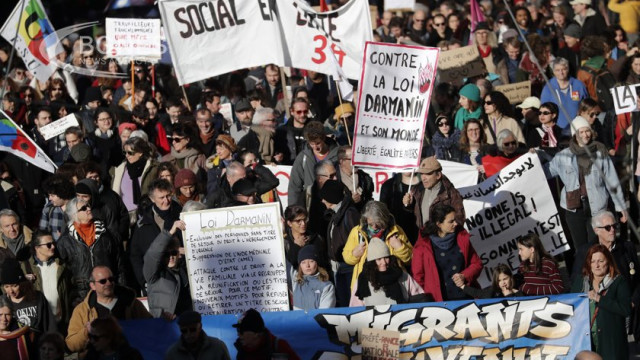 About 75,000 people protested in France against the immigration law