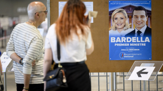 French far right wins first round of elections, Macron's alliance third