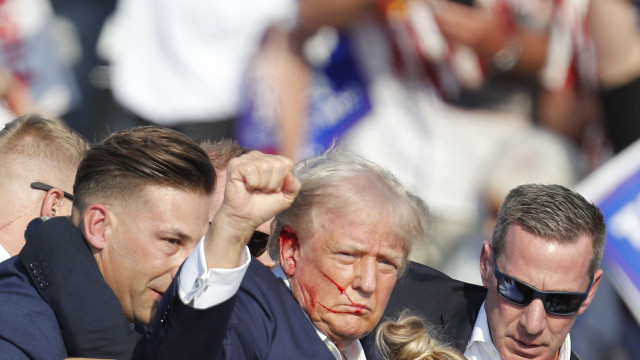 Former President Donald Trump, the Republican candidate in November's US election, was evacuated from a campaign rally in Pennsylvania with visible blood on his right ear