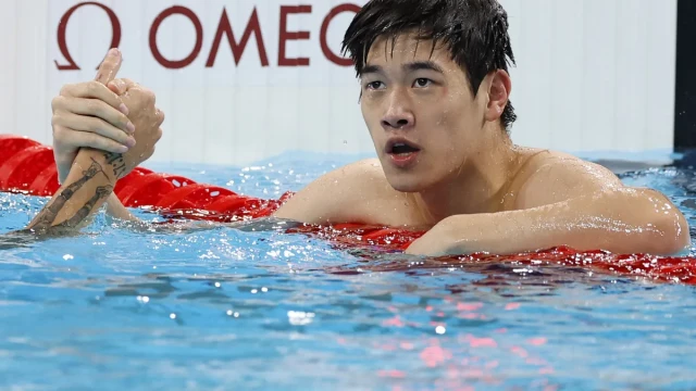 China's swimming sensation Pan Zhanle won the Olympic 100m freestyle title with a world record.