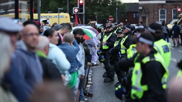 Protesters set fire to and stormed hotels used to house asylum seekers in northern England as the country grapples with its worst social unrest in years